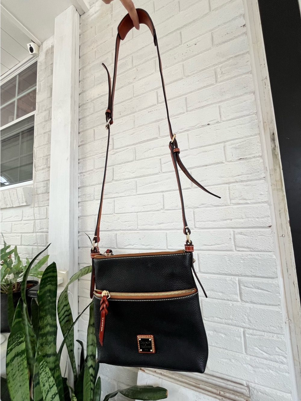 Dooney & Bourke black leather letter carrier crossbody purse, brown leather trim - Picture 3 of 12